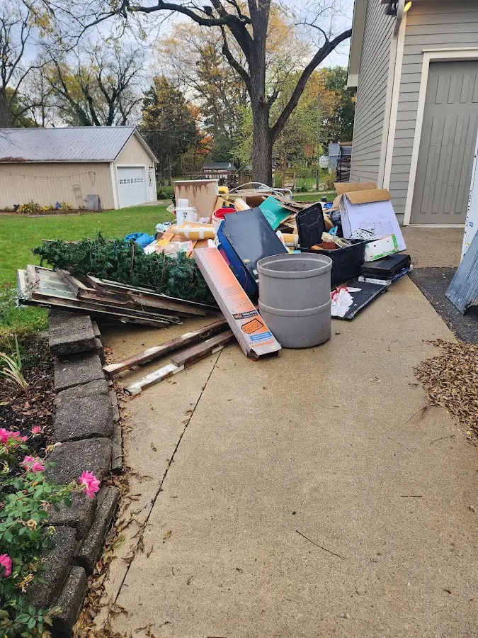 Dumpster being loaded with debris for 30 Yard Dumpster Rental in Canterbury